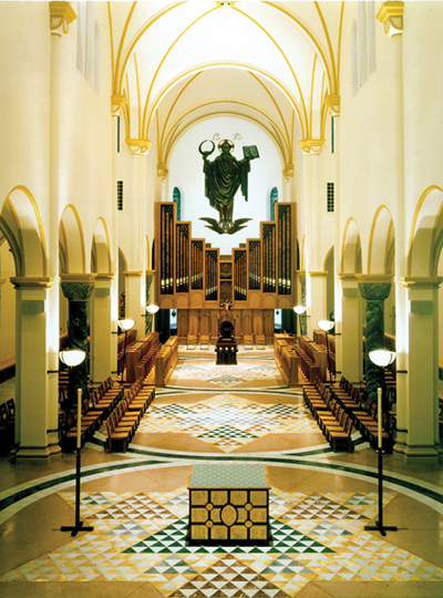 The Archabbey Church of Our Lady of Einsiedeln of Saint Meinrad Archabbey in southern Indiana (at right), a Benedictine community of men, was completed in 1907 and underwent a major renovation in 1996-1997. In 1998 it was named the first place winner in the Eugene Potente, Sr. Liturgical Design Competition. 	The renovation was extensive, with the installation of a marble floor, a new altar, the relocation of the organ, and new furnishings that included the return of the monks’ choir stalls, which had been removed from the church in the 1960s.